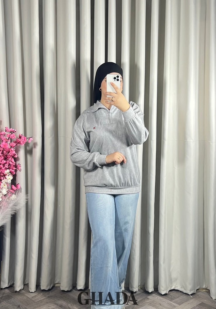 Pull en maile douce zippé à col en V